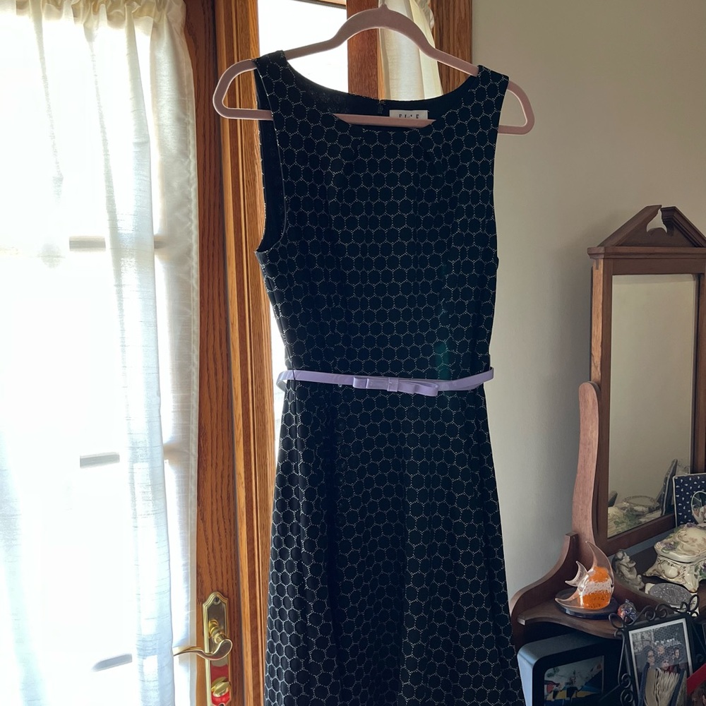 ELLE Spring and Summer Dress. Sleeveless with Flowing Skirt. Adjustable Belt.